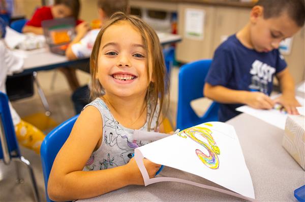 Students inside their classrooms learning. 